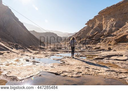 A Young Woman On A Trek In The Travertino Waterfall And Rambla De Otero In The Tabernas Desert One S