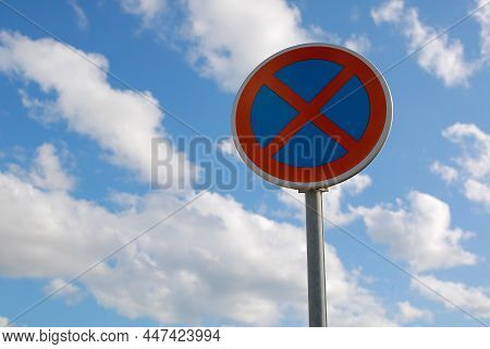 No Parking Traffic Road Sign. The Urban Clearway Sign With Blue Sky Cloudy Background