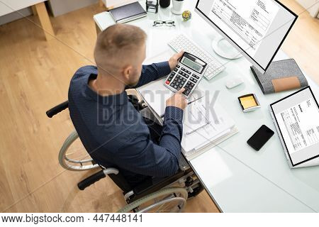 Accountant Using E Invoice Software At Computer In Office