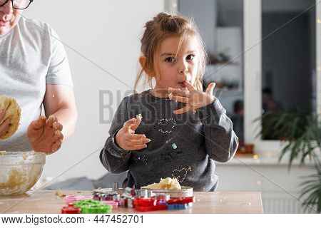 Father Feeling Playful With His Caucasian Little Daughter, While Preparing Homemade Dough For Tasty 