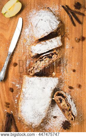 Traditional Austrian Apple Pie - Apfelstrudel With Apples, Nuts, Cinnamon And Raisins, Sliced ​​stru
