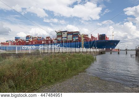 Doel, Belgium, August 17, 2020, The Container Ship Cosco Shipping From Hong Kong, Sails Very Close T