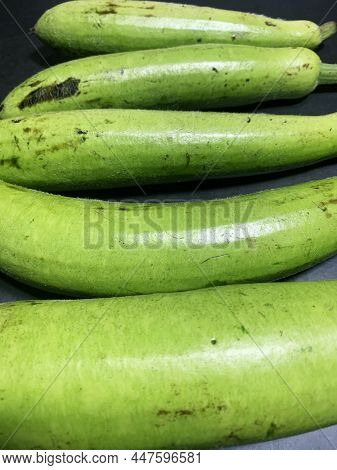 Bottle Gourd, Lagenaria Siceraria Isolated On Black Background.