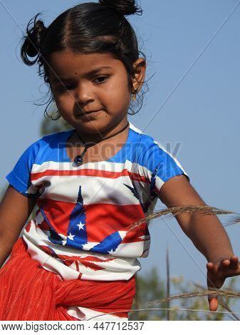 Closeup Of Beautiful Indian Girl Kid Different Actions And Facial Expressions In The Park.