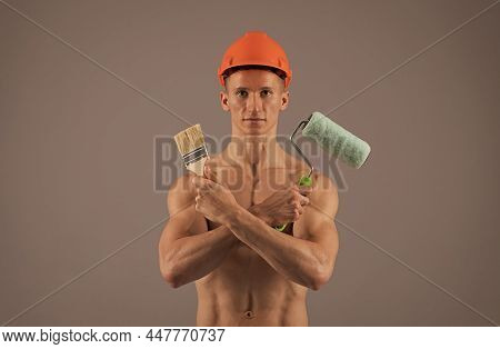 Sexy Man With Muscular Torso Hold Paintroller And Paintbrush For Decorating And Painting, Painter