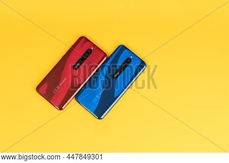 Varna, Bulgaria - May 16 , 2020: The Back Of Redmi 8 Android Smartphones In Ruby Red And Sapphire Bl