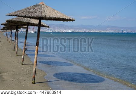 Beach Unbrellas And Chairs On Sunny Sandy Beach Lady's Mile In Akritori, Cyprus