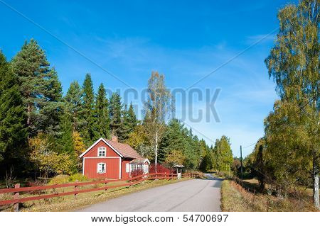 Red Wooden House In Sweden