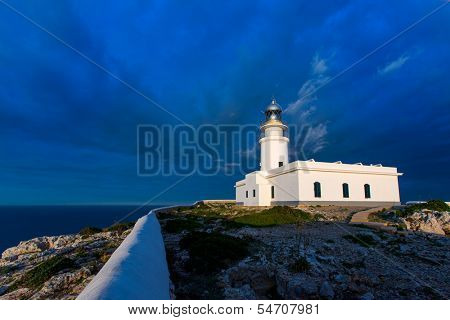 Menorca sunset in Faro Far de Caballeria Lighthouse at Balearic Islands es Mercadal