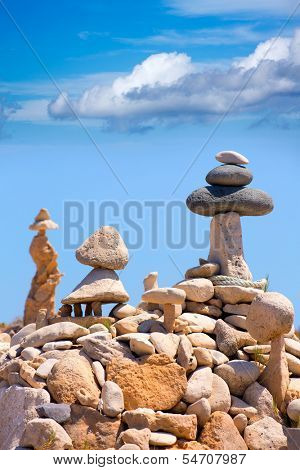 Stone figures on beach shore of Illetes beach in Formentera Mediterranean Balearic Islands