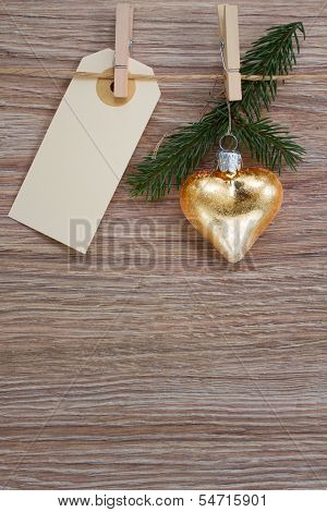 golden heart and evergreen twig with tag
