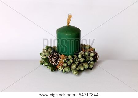 A green Christmas candle