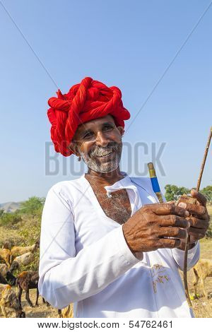 A Rajasthani Tribal Man Wearing Traditional Colorful Turban And Loves To Pose