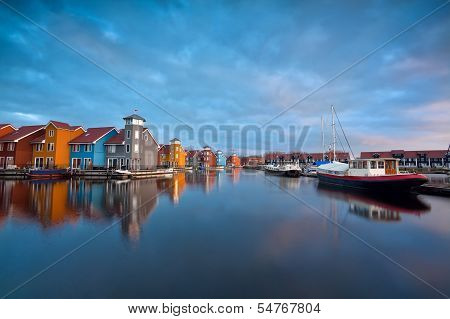 Sunrise Over Colorful Buildings And Boats In Groningen