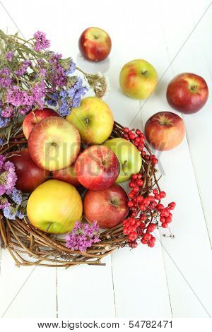Juicy apples on white wooden table