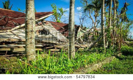 Ruins Of A House Inside Barbed Wire Fence