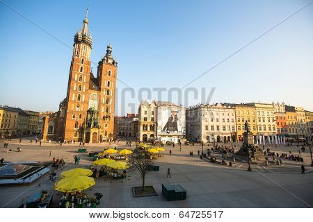 KRAKOW, POLAND - FEB 26, 2014: View of the Main Square. It dates to the 13th century, and at roughly 40,000 m it is the largest medieval town square in Europe.