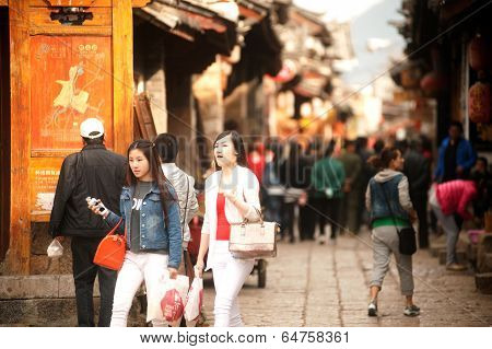 Crowd Walking In Shuhe Ancient Town.