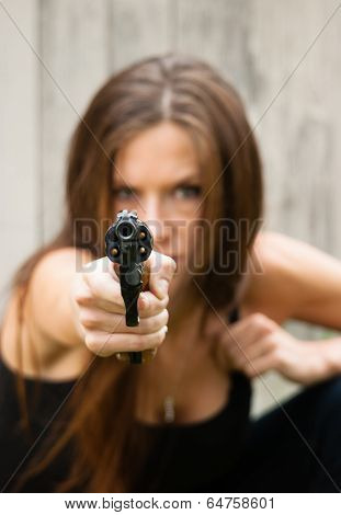 Brunette Woman Points Gun Spent Chamber Ready To Fire