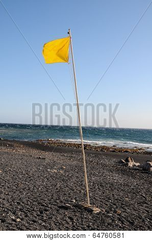Yellow Festive Flag Waving In The Wind