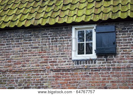white window on brick wall