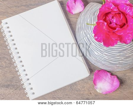 Notepad And Pink Rose In Vase