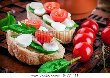 Mozzarella tomatoes and bread. Italian food