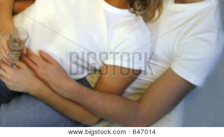 couple on sofa with glasses of wine