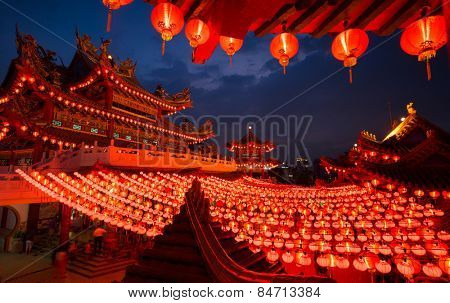 KUALA LUMPUR, MALAYSIA - FEBRUARY 23, 2015: Tourists visit the scenic Thean Hou Temple at night with hundreds of lanterns hung across the courtyard celebrating the lunar Chinese New Year.