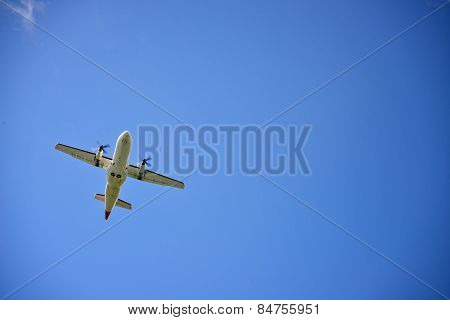 Propeller Airplane Flying In The Sky