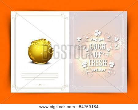 Elegant greeting card with text Luck of Irish and glossy golden pot full of coins for Happy St. Patrick's Day celebration.