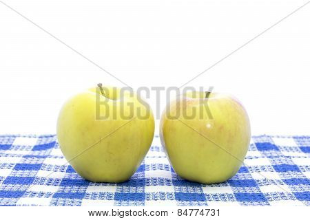 Fresh Yellow Apple Fruit On Blue Tablemat