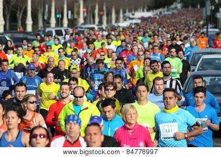 VALENCIA, SPAIN - FEBRUARY 22, 2015: Runners compete in the IV University of Valencia 5K run in the streets of Valencia.