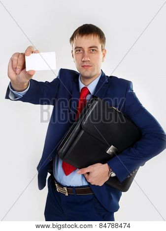 A man with a business card and portfoli