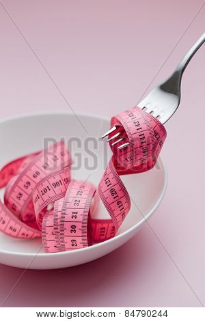 Measuring tape around fork