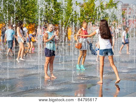 Young People Bathing In Dry Fountain