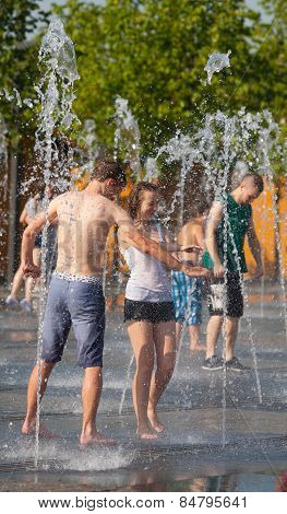 Young People Bathing In Dry Fountain
