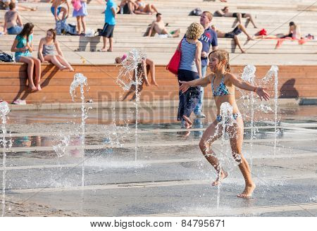 Young People Bathing In Dry Fountain