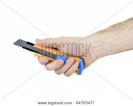 a man holding an exacto tool