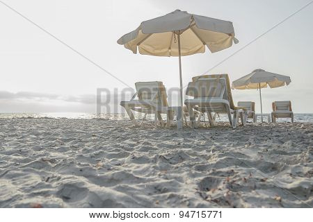 Sandy beach on Greek Kos island with parasols and sunbeds