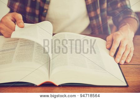 Searching For Inspiration In A Book.