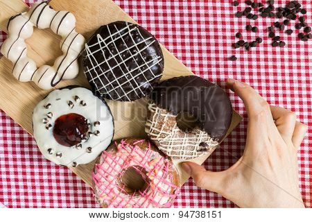 Hand Taking Doughnut Or Donut During Coffee Break