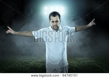 Soccer player with ball in action outdoors