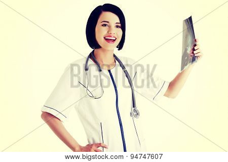 Young doctor anylising rentgen photo
