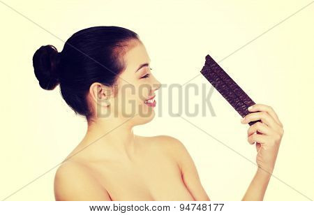Beautiful woman holding a waffer