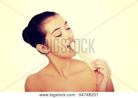 Beautiful woman eating a waffer