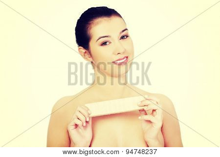 Beautiful woman holding a waffer