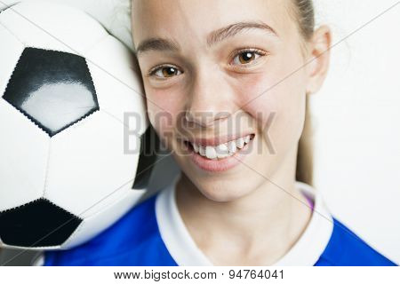 girl in sport wear with football isolated on white background