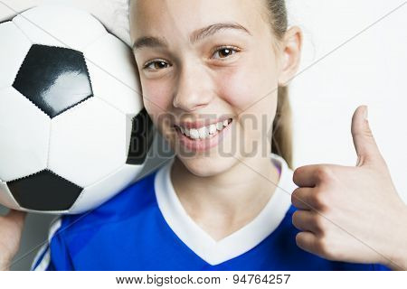 girl in sport wear with football isolated on white background