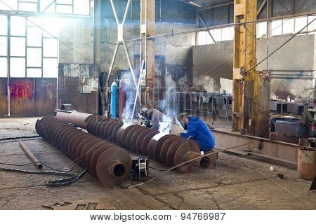 Welders Reparing Ship Parts